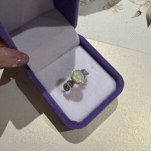 White opal stone on 925 silver setting

Adjustable